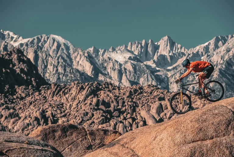 Mountain biker descending boulders in the Alabama Hills